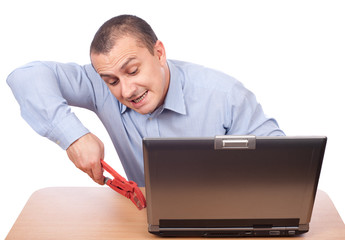 Businessman fixing laptop