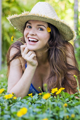 Attractive woman in hat and flowers