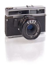 Old film camera isolated on white background