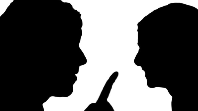 Man and woman arguing in silhouette - HD