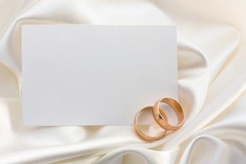 Two wedding rings and card