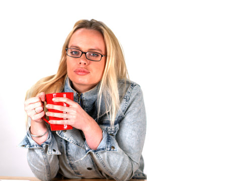 Blond Woman Drinking a Hot Beverage