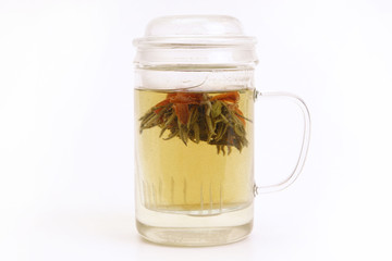 Herbal tea with tea flower in glass cup