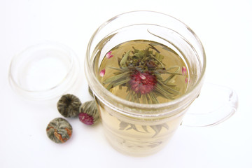 Herbal tea with tea flower in glass cup