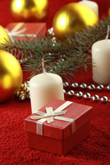 Fototapeta na wymiar Christmas gift, glassbeads and candle
