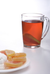Tea with a lemon and fruit candy