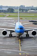 Air transportation: passenger airplane on airport ramp.