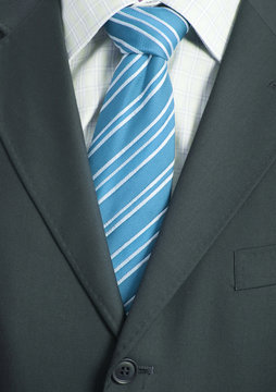 Detail of a Business man Suit with blue tie