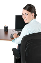 Young businesswoman typing at work, isolated on white