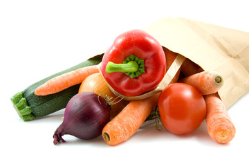 paper shopping bag with grocery over white background