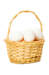 Basket full of eggs isolated on white