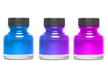 blue and pink paint in bottle