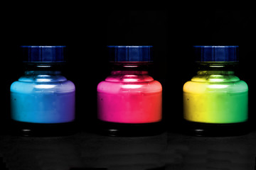 bottles full of colorful paint