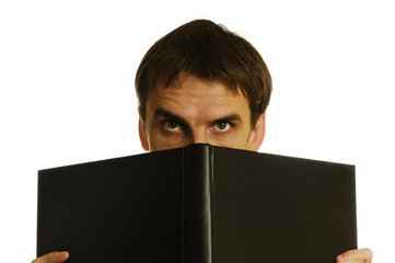 man behind the open book on white background