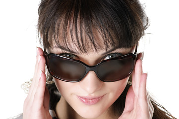Naklejka premium closeup portrait of beautiful brunettte in sunglasses