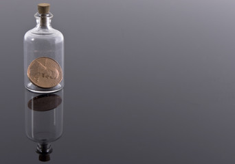 One penny in corked bottle