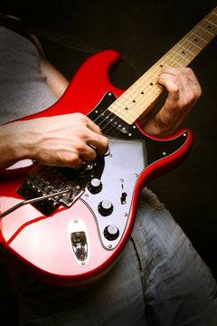 man playing electrical guitar