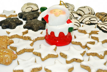 Santa-claus with Christmas assorted biscuits.