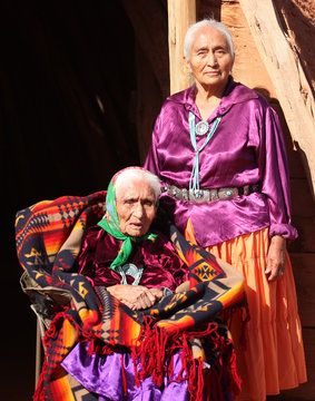 Navajo Women in Traditional Clothing Who Are Mother and Daughter