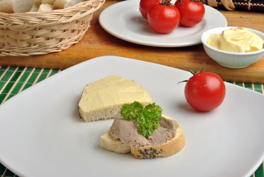 slice poppy seed bread with liver sausage on a plate