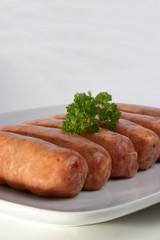 some organic pork sausages on a plate