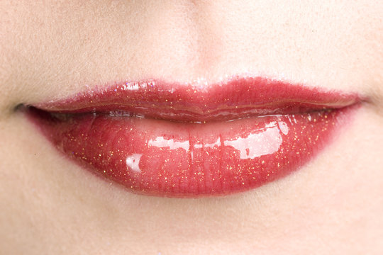 Shiny red woman's lips with make up