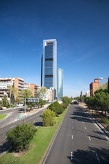 lonely highway and skyscrapers