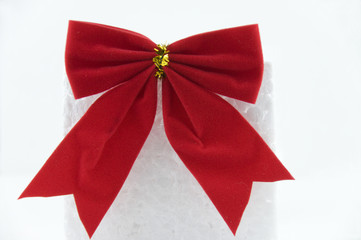 Red bow on white package