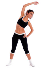 Fototapeta na wymiar Cute fitness girl stretching her body