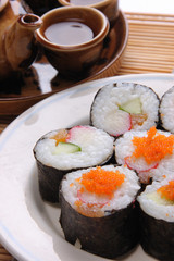 Japanese traditional food sushi with teapot as background