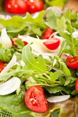 healthy salad with tomatoes, onions, lettuce and cheese