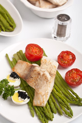 healthy fish with asparagus, tomatoes and caviar