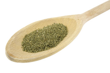 parsley herb on wooden spoon isolated on white background