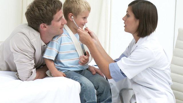 Doctor giving a small boy a check up