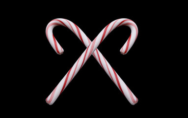 2 candy canes isolated on Black