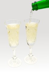 Champagne is poured into crystal goblets
