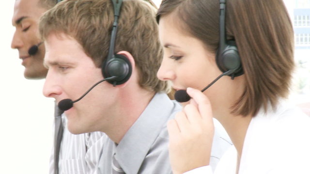 Panorama of young people working in a call center