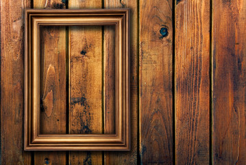 empty frame on wooden wall