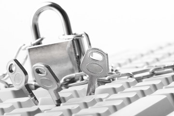Computer  keyboard secured with chain and padlock..