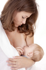 The woman feeds with a breast the child