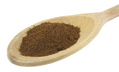 curry powder with mixing spoon isolated on white background