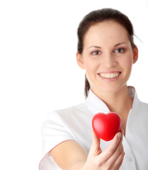 Young nurse with heart in her hand