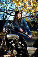 Obraz na płótnie Canvas The girl and a motorcycle