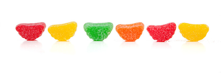 Assorted rainbow chewy candies on white