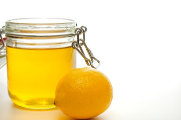 Honey jar and lemon