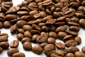 Dark and shiny Roasted coffee beans closeup