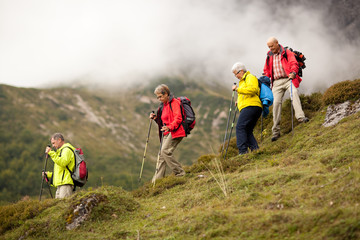senior hiking group in steep terrain