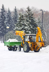 Truck with shovel remove snow