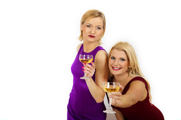 Two young sexy party girls with glass of champagne celebrating