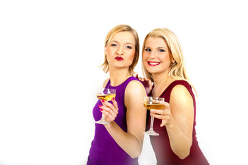 Two young sexy party girls with glass of champagne celebrating